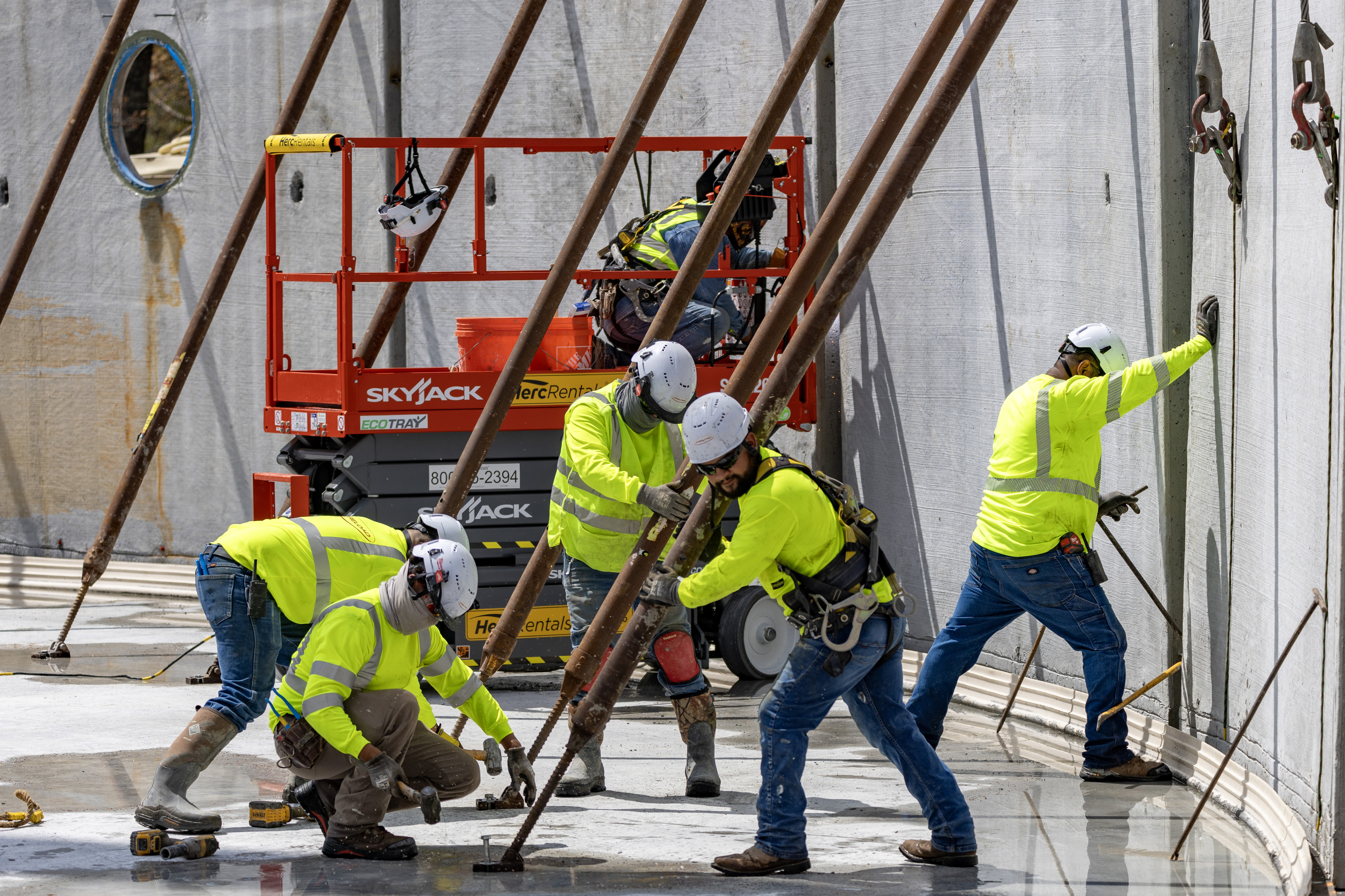 men working on a water tank